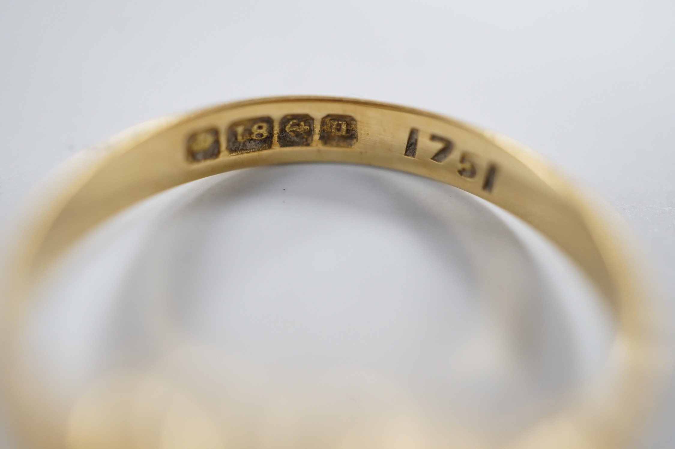 Two early 20th century 18ct and diamond cluster set rings, including graduated five stone, sizes M, gross weight 6.2 grams.